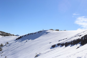 Fototapeta na wymiar Skiier Looking Over Cliffs