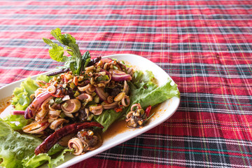 Authentic thai cockle yum salad taken outdoor with natural light