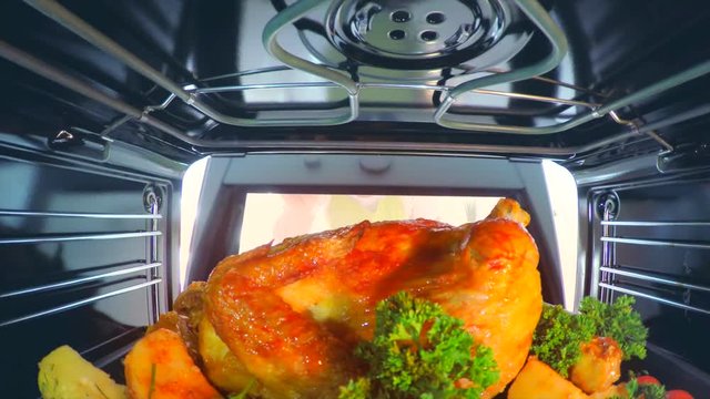 Happy Big Family With Children Cooking Chicken In The Oven Together. Holiday Dinner At Home. 4K POV Video Footage