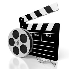 Movies concept - clapperboard, reel with tape - great for topics like making movies, cinema, movie theater etc.