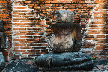 Broken buddha statue, taken outdooor in afternoon