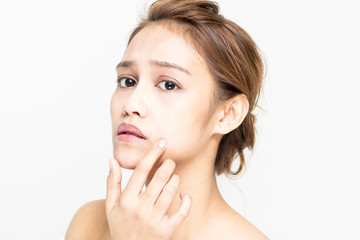 Fototapeta premium beauty girl of half latina and half asian who checks her skin, skin care, acne treatment
