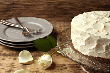 Delicious cake on wooden background