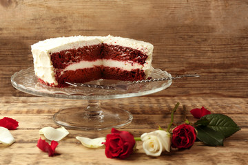 Delicious red velvet cake on wooden background