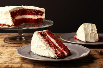 Delicious red velvet cake on wooden table