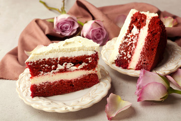 Slice of delicious red velvet cake on plate