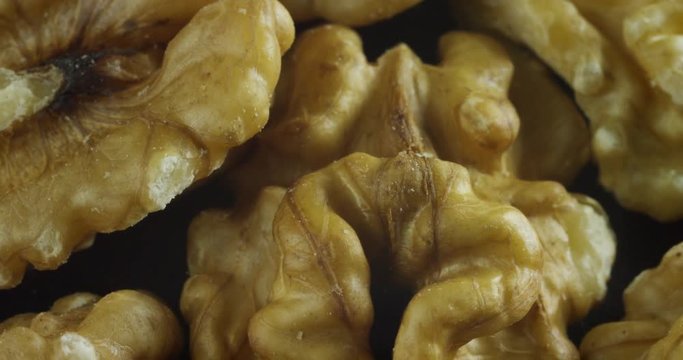 Macro shot of a walnut. Concept: dried fruits, essential oils, wellness and care for the body