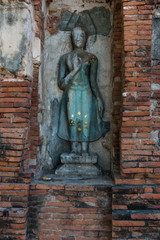 Broken buddha statue, taken outdooor in afternoon