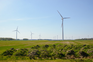 Bright blue sky moving and wind turbine