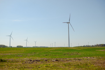 Bright blue sky moving and wind turbine