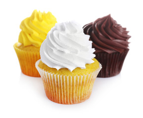 Fresh tasty cupcakes on white background