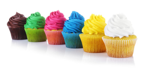 Fresh tasty cupcakes on white background
