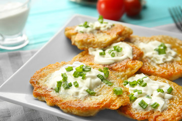 Plate with tasty potato pancakes for Hanukkah, closeup