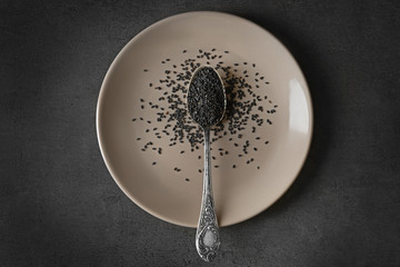 Black sesame in spoon, top view