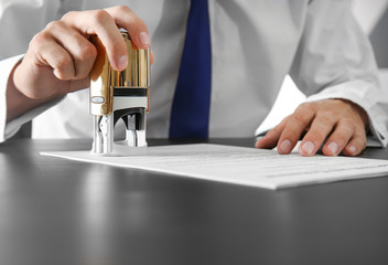 Notary public in office stamping document