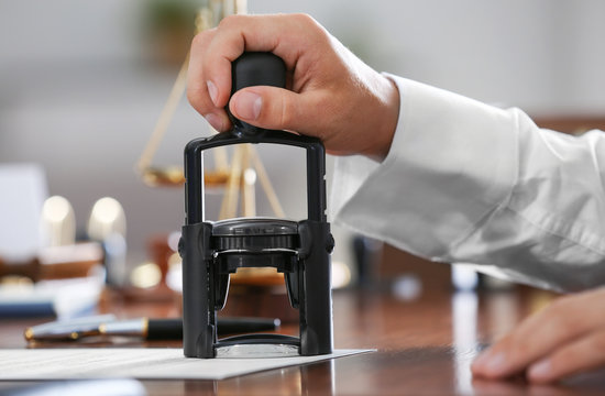 Notary public in office stamping document