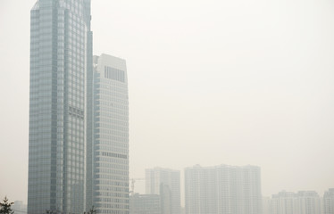 Fototapeta na wymiar modern skyscraper apartments in the fog