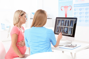 Gynecology consultation. Pregnant woman   with her doctor in clinic