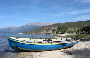Naklejka na ściany i meble Fisherman boat in Drilon, Albania