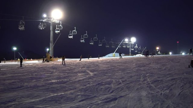 Night skiing on a snowy night with lights