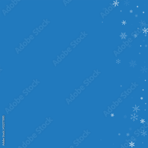 sparse snowfall abstract right border on blue background vector