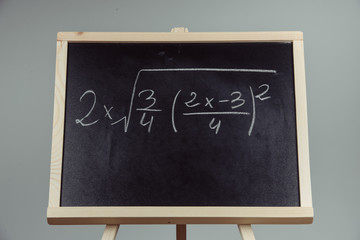 Math exercise on chalkboard