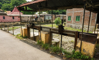 Fototapeta na wymiar Abandoned sluice gate control photo taken in Semarang Indonesia