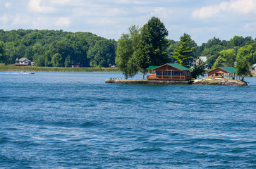 Fototapeta premium Small island with a cottage and a boathouse