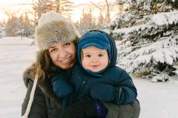 Happy mom and toddler in Winter
