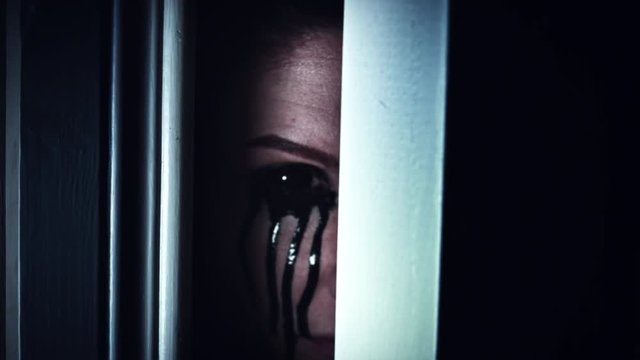 4K Thriller Woman Blackout Eye with black Tears Looking in Door Gap
