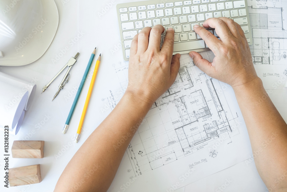 Poster architect or engineer working on keyboard blueprint and architec