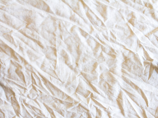 the crumpled white fabric texture surface background