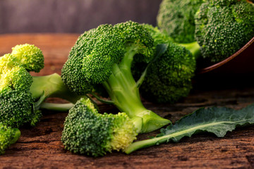 selective focus fresh green broccoli on wooden 