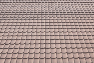 ceramic tile roof on a background of house.