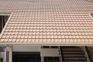ceramic tile roof on a background of house.