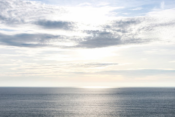 Fototapeta na wymiar Blue sea with waves and clear blue sky