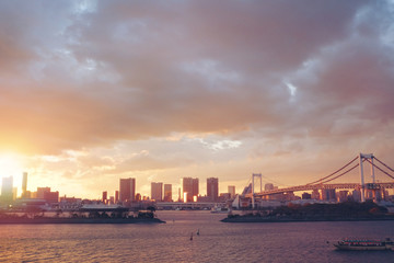 Fototapeta premium Sunset view of city line and Rainbow Bridge