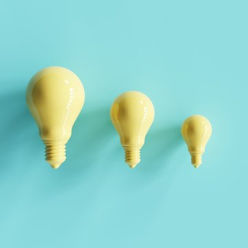 Different Size of yellow pantone light bulbs concept. minimal concept..