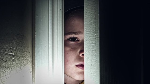 4K Thriller Child Eye Looking Around through Door Gap