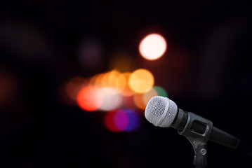 Fototapeta na wymiar Microphone on stage background 