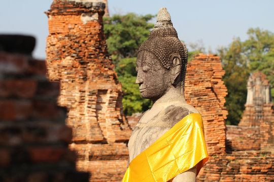above body part of sitting ancient buddha statue, one of the most important and visiting historical landmark at ayutthaya, Thailand for tourism