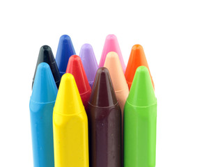 Crayons standing erect against white background