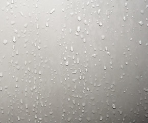 Water droplets adhered on the bathroom door.