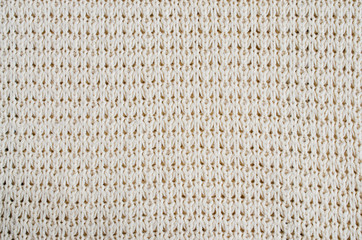 Vintage Beige Knitted Fabric Texture. Crochet Warm Woolen Yarn Background.