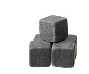 The gray whiskey stones stacked in pyramid on a white background