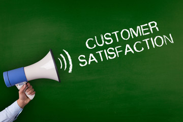 Hand Holding Megaphone with CUSTOMER SATISFACTION Announcement