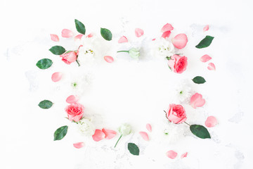 Frame made of rose flowers on white background. Flat lay, top view