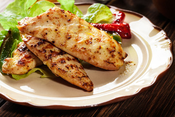 Grilled chicken breasts served with grilled paprika
