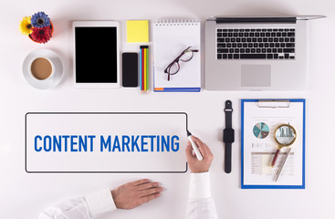 Businessman Writing the Words CONTENT MARKETING Concept