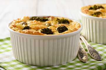 Casserole with potatoes, minced meat, broccoli and cheese.